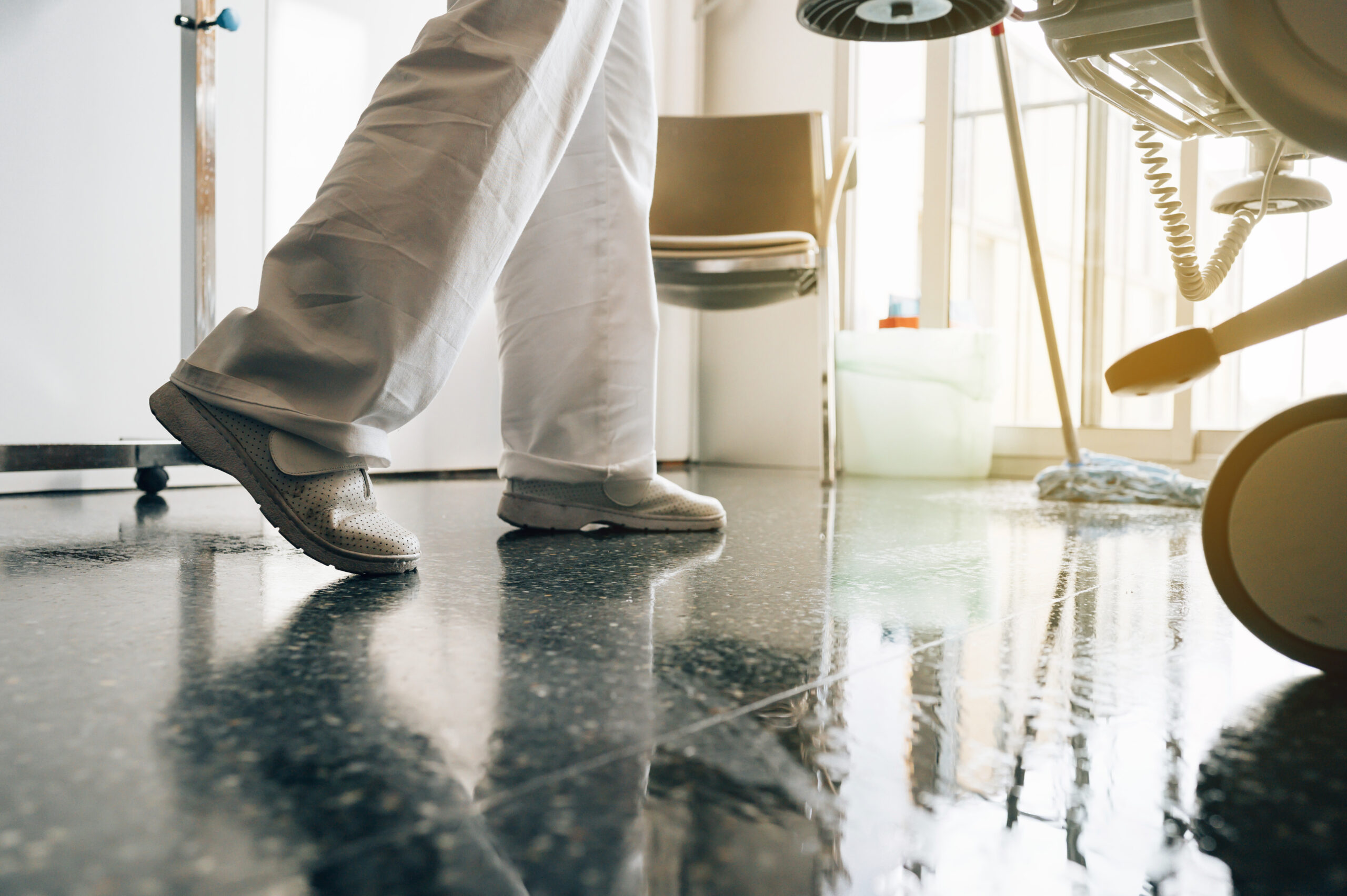 Concept photo of a hospital worker doing cleaning in the room
